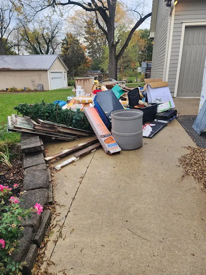 Dumpster being loaded with debris for Commercial Dumpster Rental in Mashpee